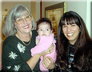 Cori, who cannot wait to be a grandma, with a friend and little Payton - Christmas, 2001