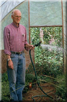 Pete tending to his greenhouse