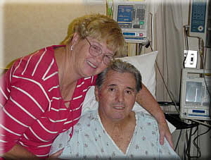 Hugs for My Handsome Husband. Ruth and George happy to bet back on the road to recovery, 7 days after his surgery (Sept. 4, 2003).