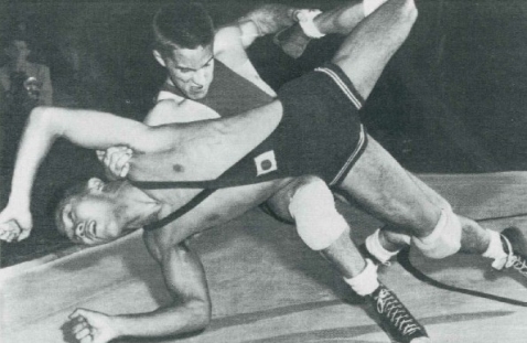 Terry McCann taking down his opponent, 1950s