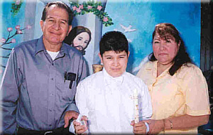 Eduardo, Eduardo Jr. and wife Maria at Eduardo's 1st Communion. August 16, 2002